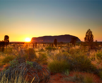 Solnedgang over Ayers Rock/Uluru i Australien